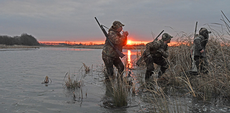 Hunters at pond