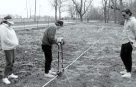 Dr. Mark Schurr, a University of Notre Dame Archaeologist, demonstrates the use of non-invasive technology on an archaeological site to Native Americans in the Prophetstown State Park area.