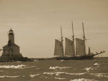 Sail boat and lighthouse