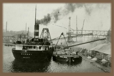 Historic picture, view of vessel’s stern, unloading gravel cargo, circa 1930-1935.Used with permission, Great Lakes Marine Collection of the Milwaukee Public Library / Milwaukee Public Library.