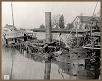 Historic picture of vessel at dock after being burned, view of vessel’s starboard side, 1911.