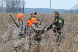 Hunters with an Indiana Conservation Officer