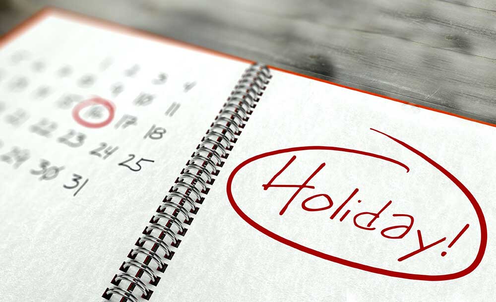 Holiday image. Picture of a calendar in a notebook with a holiday circled